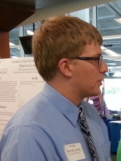 Photo of Phillip S during poster session presenting EnSURE work Photo of Phillip S during poster session presenting EnSURE work
