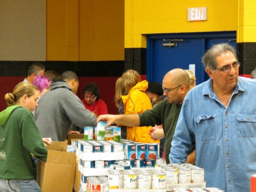 Volunteers pack Weekend Survival Kits for distribution to Lansing school children. Photo provided by Randy A. Bell, Extension Educator, MSU Extension Volunteers pack Weekend Survival Kits for distribution to Lansing school children. Photo provided by Randy A. Bell, Extension Educator, MSU Extension
