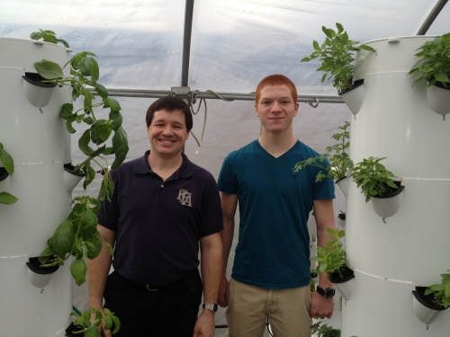 Olivet High School Agriscience Teacher and FFA Advisor Doug Pennington and high school student and 4-H member Dalton Humphrey pose next to hydroponic garden structures. Photo courtesy of Christine Sisung. Olivet High School Agriscience Teacher and FFA Advisor Doug Pennington and high school student and 4-H member Dalton Humphrey pose next to hydroponic garden structures. Photo courtesy of Christine Sisung.