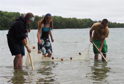 Great Lakes Natural Resource Camp participants gathering samples. Great Lakes Natural Resource Camp participants gathering samples.