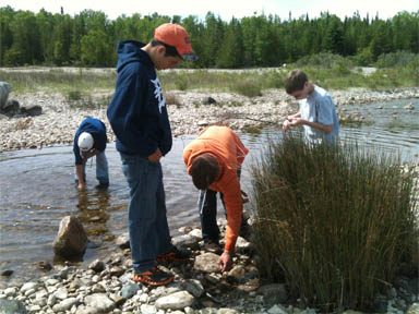 Students exploring the shore in Thompson's Harbor State Park in Michigan. Students exploring the shore in Thompson's Harbor State Park in Michigan.