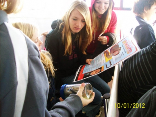 Students examining sea lamprey. Students examining sea lamprey.